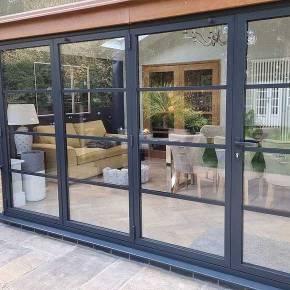 Origin bi-folding doors (OB49) with Atragal bars in anthracite grey